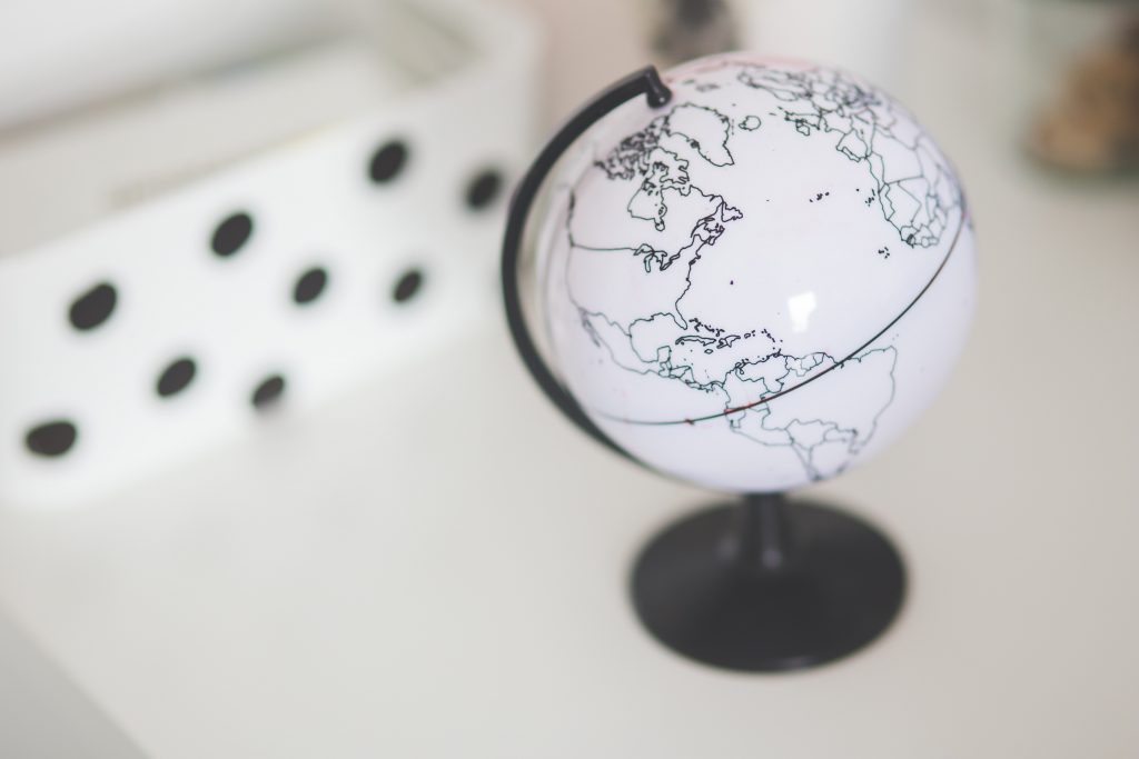 A black and white globe on a table
